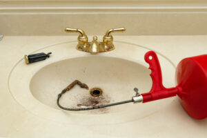 Plumbing snake with hair clog in a bathroom sink Fort Worth, TX